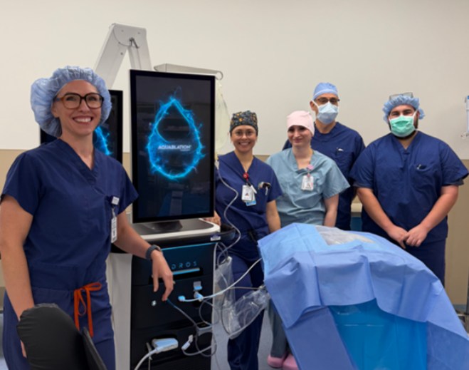 Medical team standing beside HYDROS System